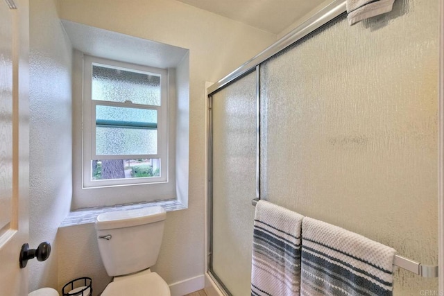 1651 S Juniper St Unit 106, Escondido, CA 92025 - full bathroom featuring toilet, a stall shower, and baseboards