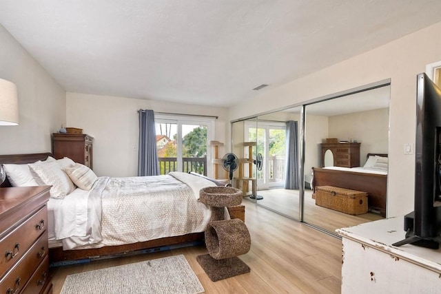 1651 S Juniper St Unit 106, Escondido, CA 92025 - bedroom with access to exterior and light wood-style flooring
