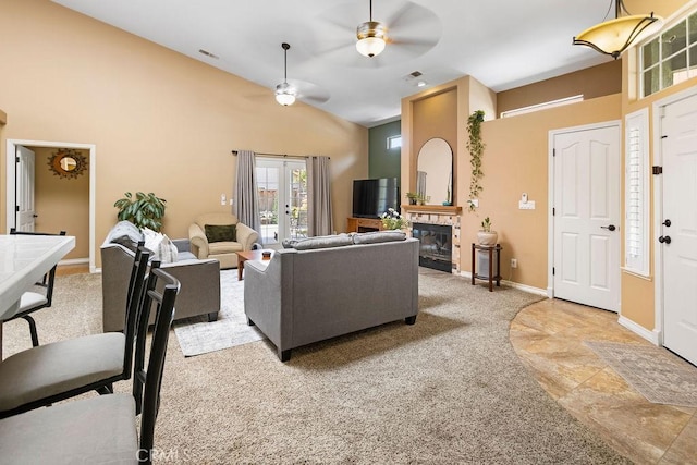 3475 Paseo Verde Ave, Merced, CA 95348 - living room featuring a ceiling fan, high vaulted ceiling, light colored carpet, a fireplace, and baseboards