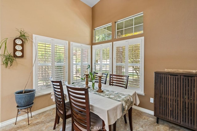3475 Paseo Verde Ave, Merced, CA 95348 - dining space featuring baseboards and a towering ceiling