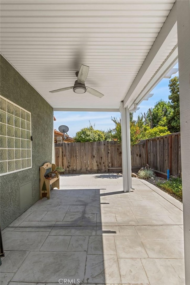 3475 Paseo Verde Ave, Merced, CA 95348 - fenced backyard featuring a ceiling fan and a patio area