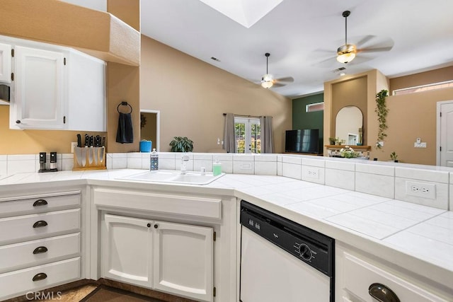 3475 Paseo Verde Ave, Merced, CA 95348 - kitchen with white dishwasher, tile countertops, a sink, a ceiling fan, and lofted ceiling