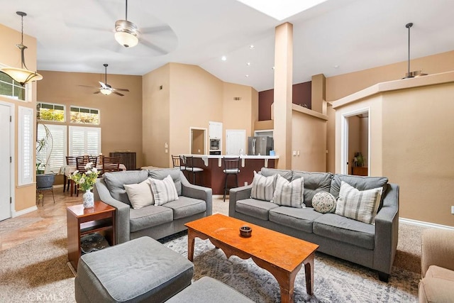 3475 Paseo Verde Ave, Merced, CA 95348 - living room featuring high vaulted ceiling, a ceiling fan, and baseboards