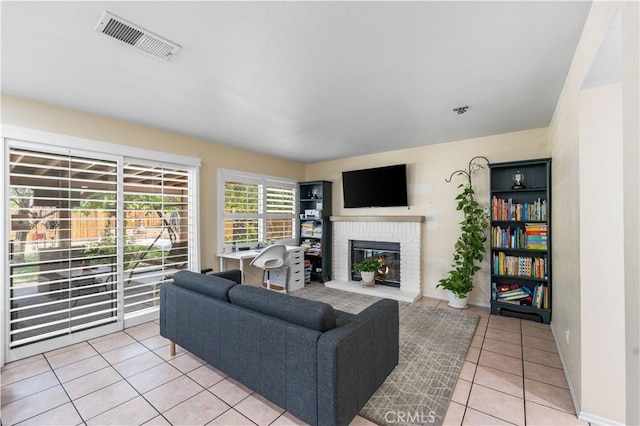 37398 Harrow Ct, Palmdale, CA 93550 - living room featuring light tile patterned floors and a fireplace
