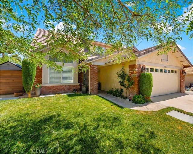37398 Harrow Ct, Palmdale, CA 93550 - view of front facade featuring an attached garage, brick siding, and a front lawn