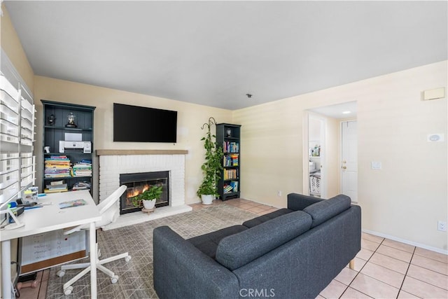 37398 Harrow Ct, Palmdale, CA 93550 - living area featuring a fireplace, light tile patterned floors, and a desk