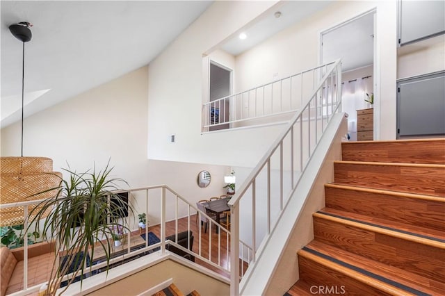37398 Harrow Ct, Palmdale, CA 93550 - staircase with vaulted ceiling and recessed lighting