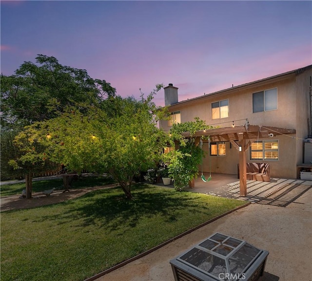 37398 Harrow Ct, Palmdale, CA 93550 - yard at dusk featuring a pergola, a patio, and a lawn