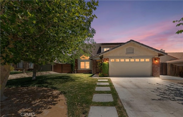 37398 Harrow Ct, Palmdale, CA 93550 - view of front facade featuring an attached garage, driveway, and brick siding