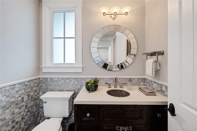 2711 Elm Ave, Manhattan Beach, CA 90266 - half bath featuring vanity, toilet, wainscoting, and tile walls