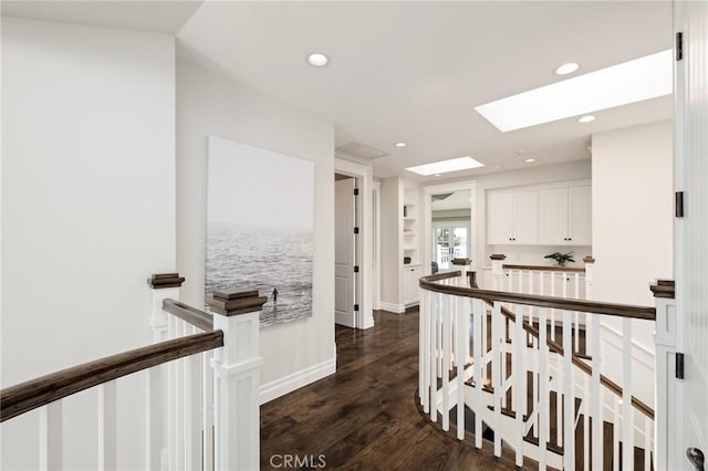 2711 Elm Ave, Manhattan Beach, CA 90266 - hall with an upstairs landing, a skylight, dark wood finished floors, and recessed lighting
