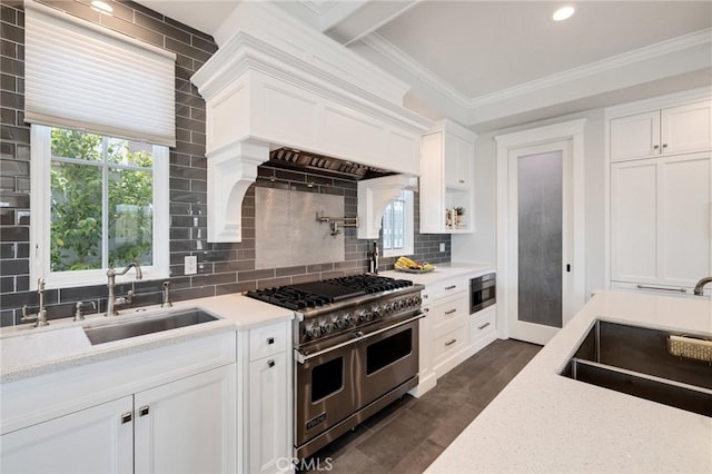 2711 Elm Ave, Manhattan Beach, CA 90266 - kitchen featuring double oven range, a sink, white cabinets, tasteful backsplash, and crown molding