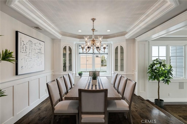 2711 Elm Ave, Manhattan Beach, CA 90266 - dining area featuring a chandelier, dark wood-type flooring, a decorative wall, crown molding, and a tray ceiling
