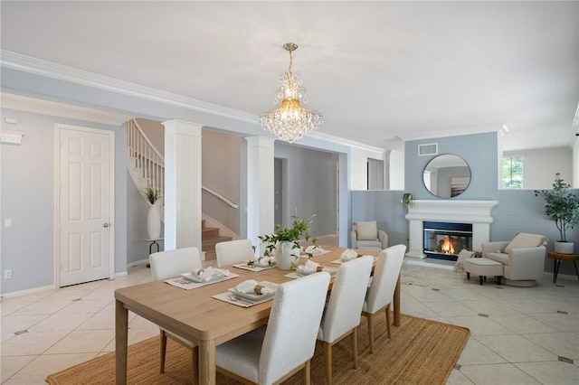 24274 Reyes Adobe Way, Valencia, CA 91354 - dining area featuring light tile patterned flooring, crown molding, stairway, a chandelier, and a glass covered fireplace