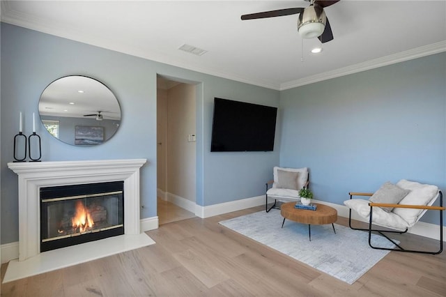 24274 Reyes Adobe Way, Valencia, CA 91354 - sitting room with a ceiling fan, wood finished floors, crown molding, baseboards, and recessed lighting