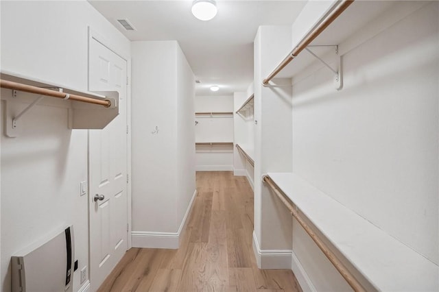 24274 Reyes Adobe Way, Valencia, CA 91354 - spacious closet featuring light wood-style floors