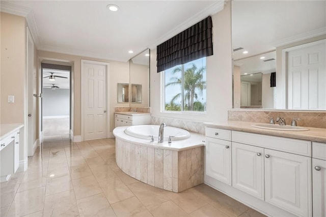 24274 Reyes Adobe Way, Valencia, CA 91354 - bathroom with two vanities, a bath, a ceiling fan, recessed lighting, and crown molding