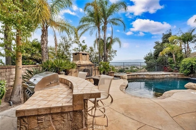 24274 Reyes Adobe Way, Valencia, CA 91354 - view of pool featuring an outdoor stone fireplace, a fenced backyard, and a patio