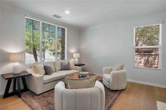 24274 Reyes Adobe Way, Valencia, CA 91354 - living room featuring wood finished floors, healthy amount of natural light, baseboards, crown molding, and recessed lighting