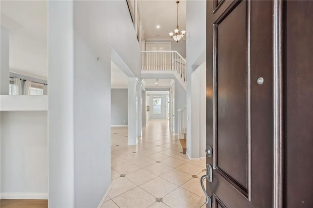 24274 Reyes Adobe Way, Valencia, CA 91354 - entrance foyer with baseboards, light tile patterned floors, a chandelier, a high ceiling, and ornamental molding