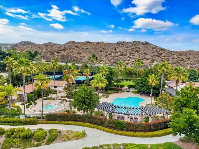 24274 Reyes Adobe Way, Valencia, CA 91354 - community pool featuring a mountain view