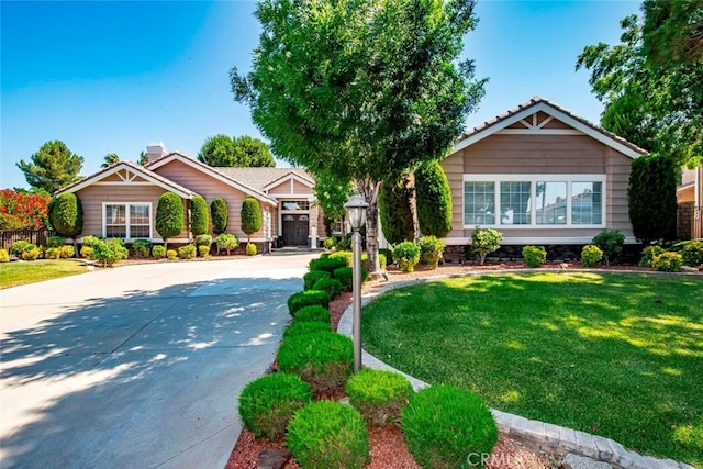5618 Gardendale Ln, Palmdale, CA 93551 - ranch-style house featuring driveway, a front lawn, and a chimney