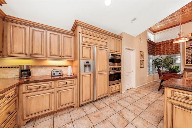 5618 Gardendale Ln, Palmdale, CA 93551 - kitchen featuring paneled built in fridge, backsplash, double oven, decorative light fixtures, and dark stone counters
