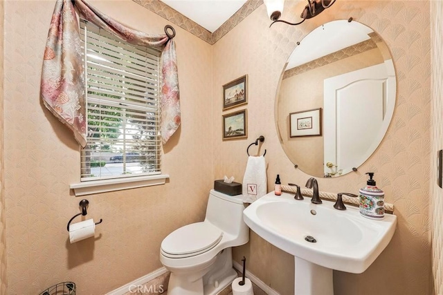 5618 Gardendale Ln, Palmdale, CA 93551 - half bathroom with toilet, a sink, and baseboards
