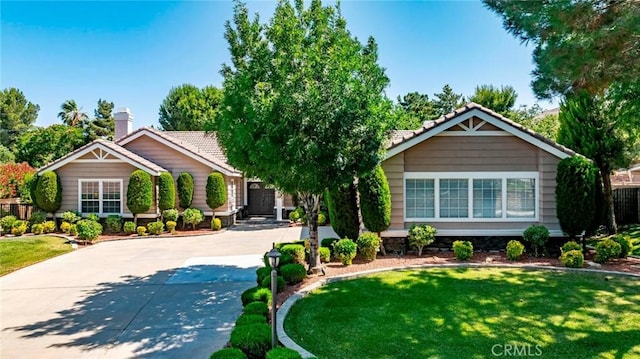 5618 Gardendale Ln, Palmdale, CA 93551 - view of front of house with a tiled roof, driveway, and a front yard