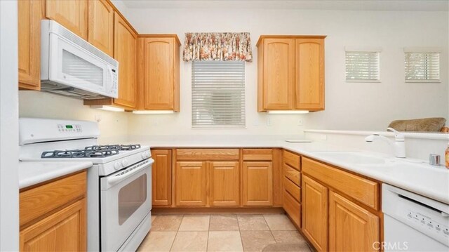 19484 Vermillion Ln, Apple Valley, CA 92308 - kitchen with white appliances, a sink, and light countertops