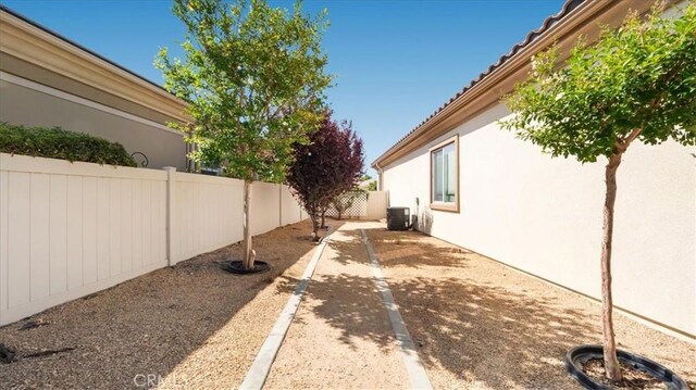 19484 Vermillion Ln, Apple Valley, CA 92308 - fenced backyard featuring cooling unit