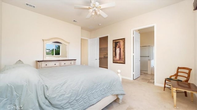 19484 Vermillion Ln, Apple Valley, CA 92308 - bedroom with light colored carpet, baseboards, a spacious closet, a ceiling fan, and ensuite bathroom