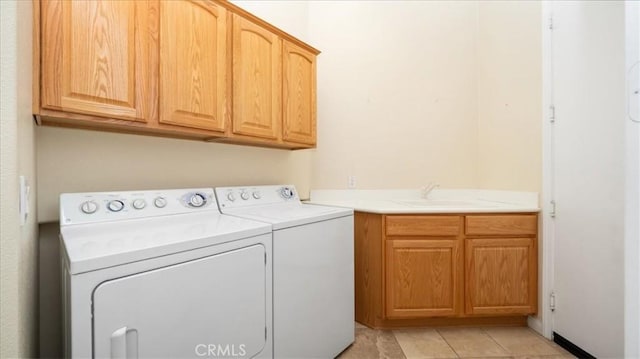 19484 Vermillion Ln, Apple Valley, CA 92308 - laundry room with cabinet space, separate washer and dryer, and light tile patterned floors