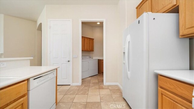 19484 Vermillion Ln, Apple Valley, CA 92308 - kitchen featuring white appliances, washer and clothes dryer, light countertops, and baseboards
