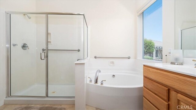 19484 Vermillion Ln, Apple Valley, CA 92308 - full bathroom with a shower stall, vanity, and a garden tub
