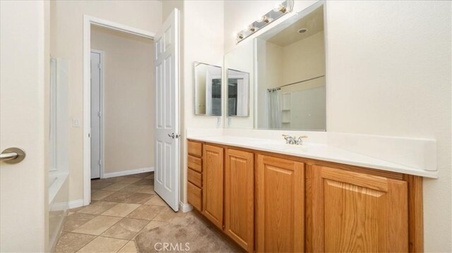 19484 Vermillion Ln, Apple Valley, CA 92308 - bathroom featuring vanity and baseboards