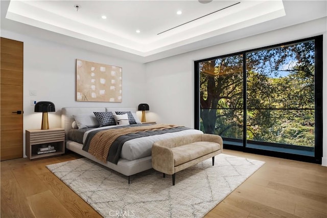 14899 Round Vly, Sherman Oaks, CA 91403 - bedroom featuring a tray ceiling, wood finished floors, and recessed lighting