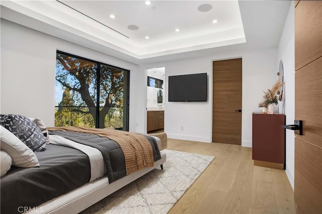 14899 Round Vly, Sherman Oaks, CA 91403 - bedroom with light wood finished floors, recessed lighting, a tray ceiling, baseboards, and ensuite bathroom