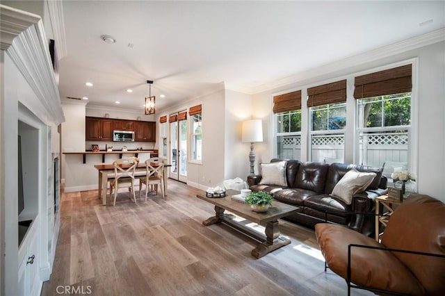 1 Evergreen Rd, Ladera Ranch, CA 92694 - living room featuring crown molding, baseboards, recessed lighting, and light wood-style floors