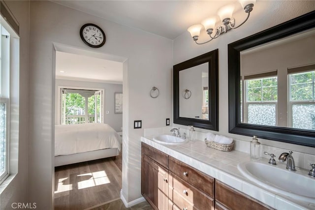 1 Evergreen Rd, Ladera Ranch, CA 92694 - bathroom featuring double vanity, plenty of natural light, wood finished floors, and ensuite bath