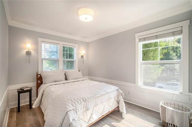 1 Evergreen Rd, Ladera Ranch, CA 92694 - bedroom with crown molding, multiple windows, wood finished floors, and baseboards