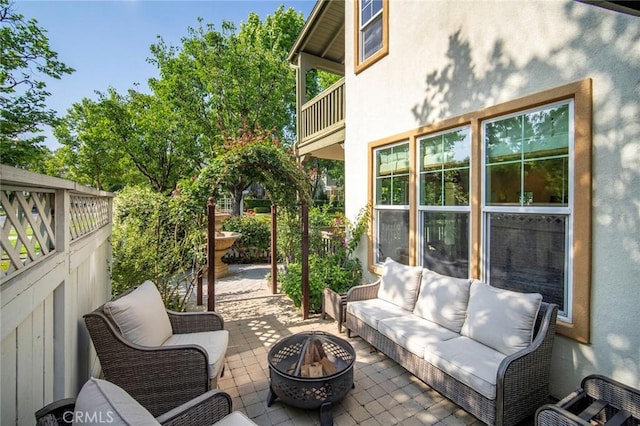 1 Evergreen Rd, Ladera Ranch, CA 92694 - view of patio with an outdoor living space with a fire pit and a balcony