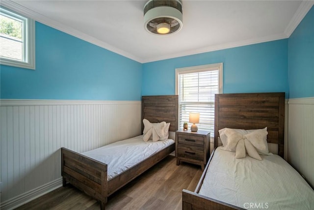 1 Evergreen Rd, Ladera Ranch, CA 92694 - bedroom featuring wood finished floors, wainscoting, multiple windows, and ornamental molding