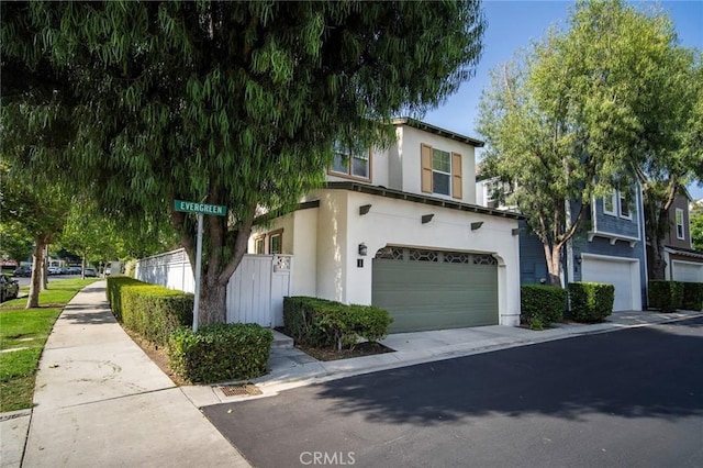 1 Evergreen Rd, Ladera Ranch, CA 92694 - view of front of house featuring an attached garage, stucco siding, and concrete driveway
