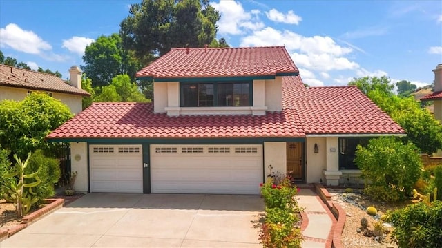 650 Bull Frog Cir, Walnut, CA 91789 - mediterranean / spanish-style house with a tile roof, concrete driveway, stucco siding, and an attached garage