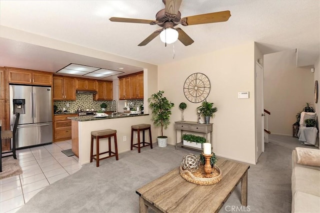 650 Bull Frog Cir, Walnut, CA 91789 - living area featuring light colored carpet, ceiling fan, light tile patterned floors, and stairway