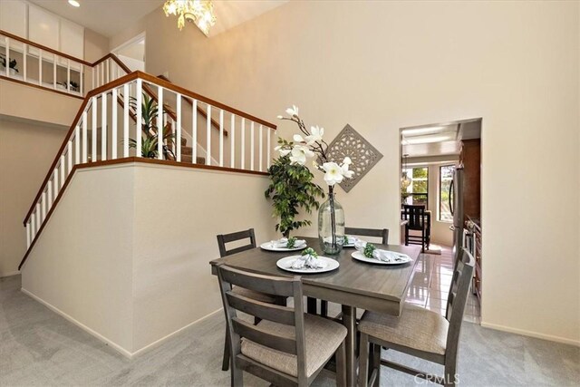 650 Bull Frog Cir, Walnut, CA 91789 - dining room featuring carpet flooring, stairs, and a high ceiling
