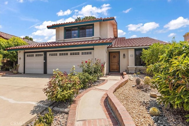 650 Bull Frog Cir, Walnut, CA 91789 - mediterranean / spanish home with stucco siding, driveway, a tiled roof, and a garage
