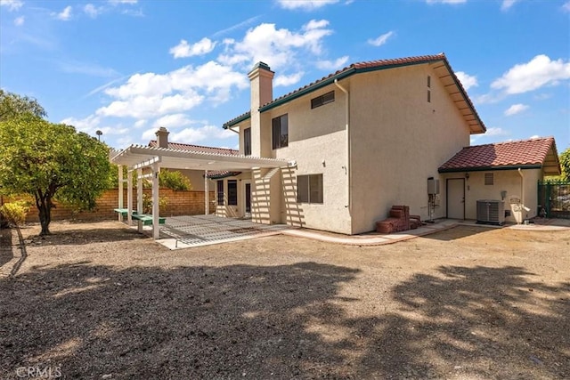650 Bull Frog Cir, Walnut, CA 91789 - rear view of house with a pergola, a chimney, a fenced backyard, a tile roof, and a patio area