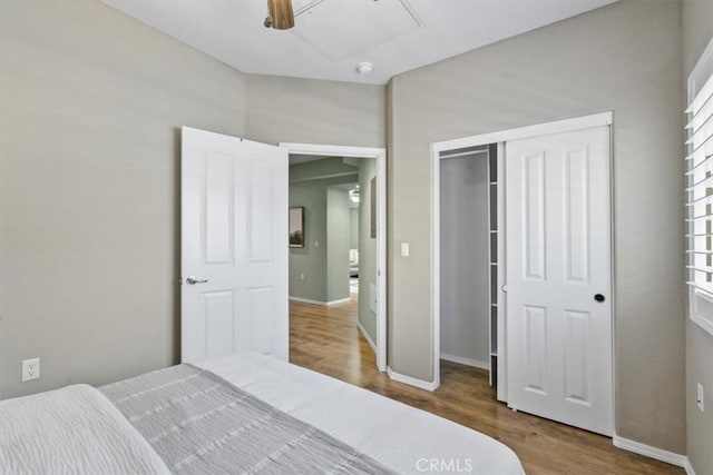 579 Camino Mercado Unit 504, Arroyo Grande, CA 93420 - bedroom with wood finished floors, attic access, baseboards, a closet, and a ceiling fan